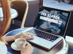 woman looking at online website to search a new job